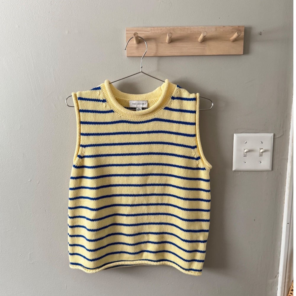 yellow sweater vest
